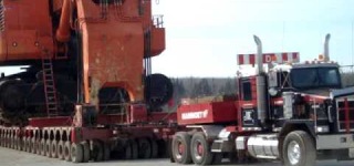 Mammoet Fort McMurray Hits the Road with a Gigantic Hitachi EX5500 Behind
