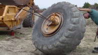 This Is How to Remove a Huge Tire Off a Scraper