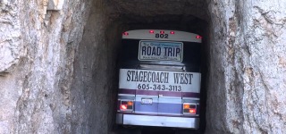 Bus Drives Through Extremely Narrow Tunnel in Needles Highway of South Dakota